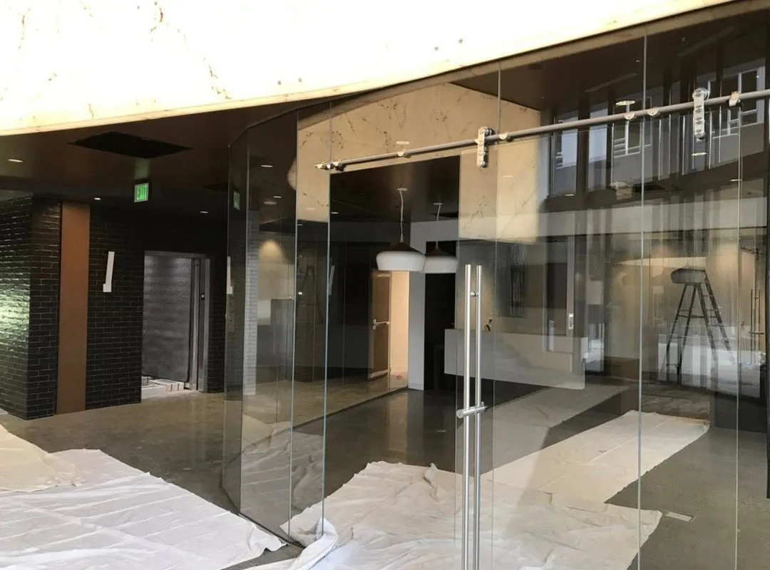 Installing a glass frame room in a modern interior lobby in Phoenix, AZ