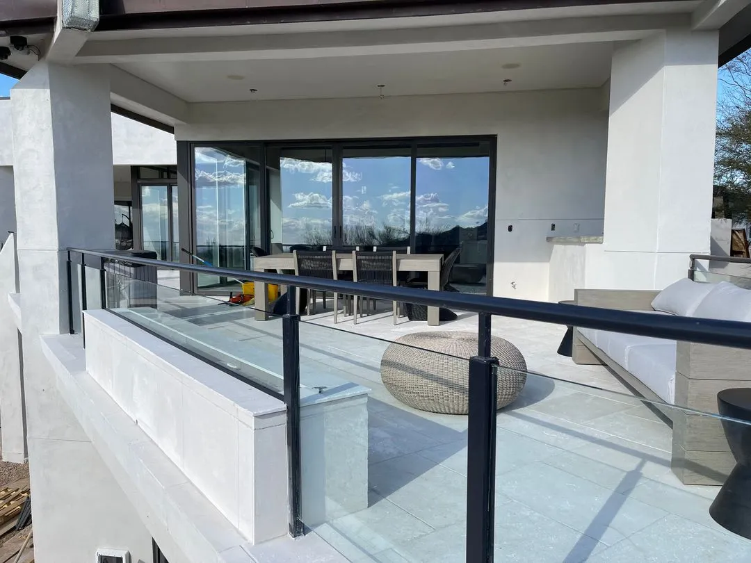 Installing the glass balcony frames for a modern desert style home in Scottsdale